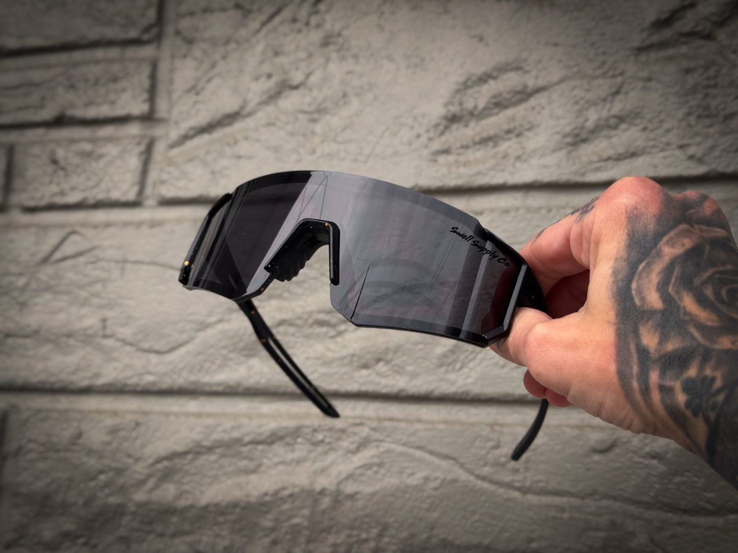 Adult black rimless mirrored sports sunglasses w/ golden speckles