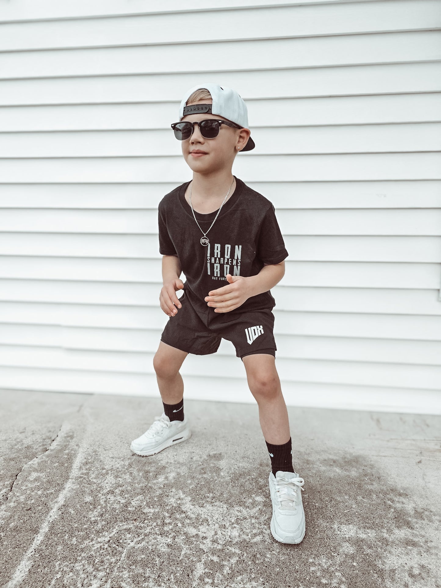 Wrestling pendant on 3mm stainless silver figaro