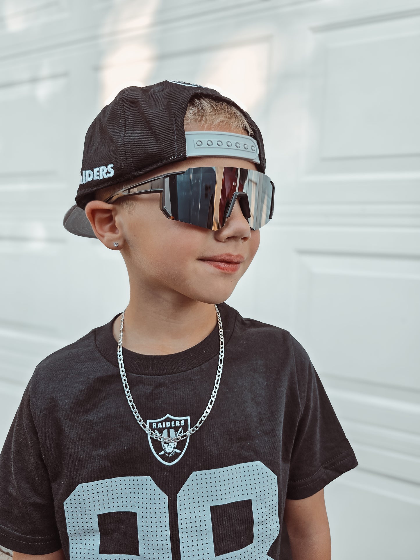 Black sports sunnies w/ silver lens