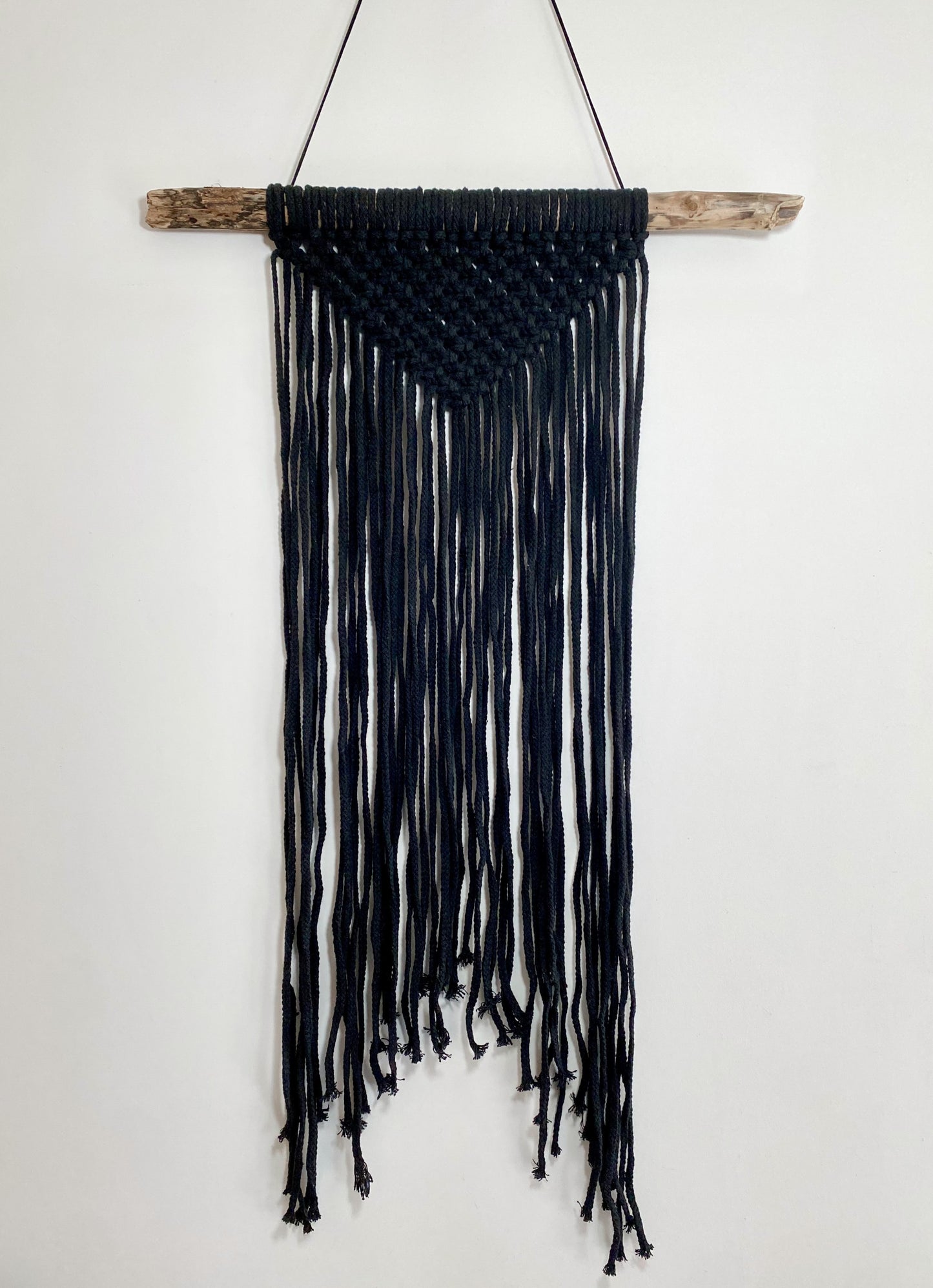Black macrame wall hanging