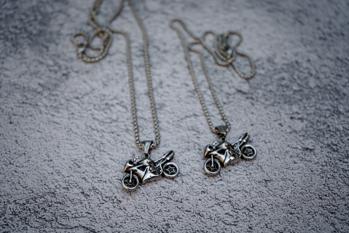 Moto pendant necklace