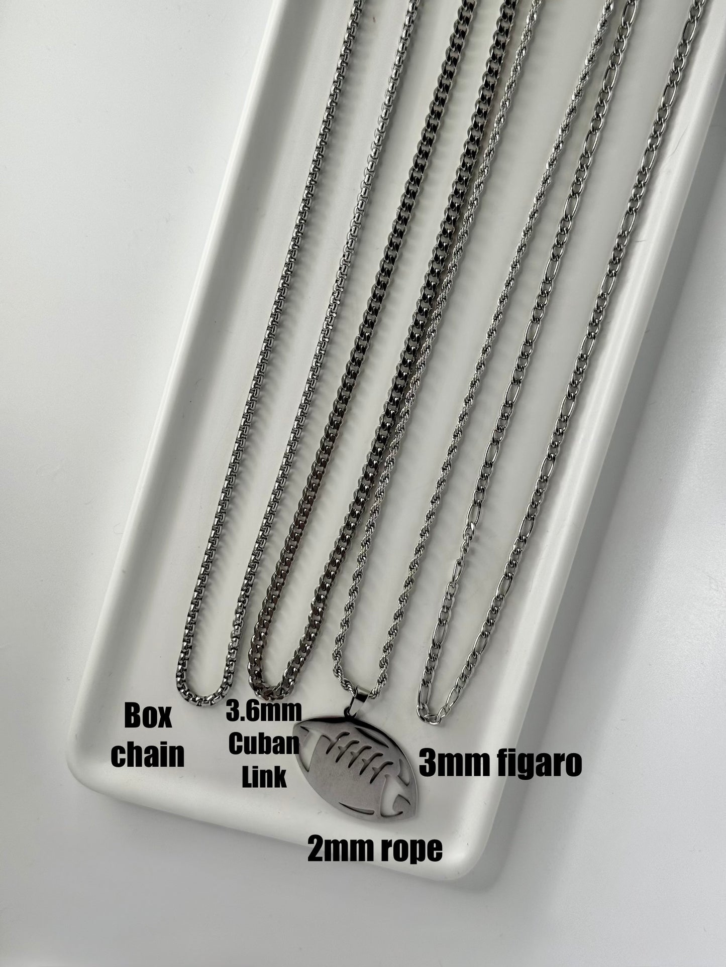 Silver stainless football on choice of chain