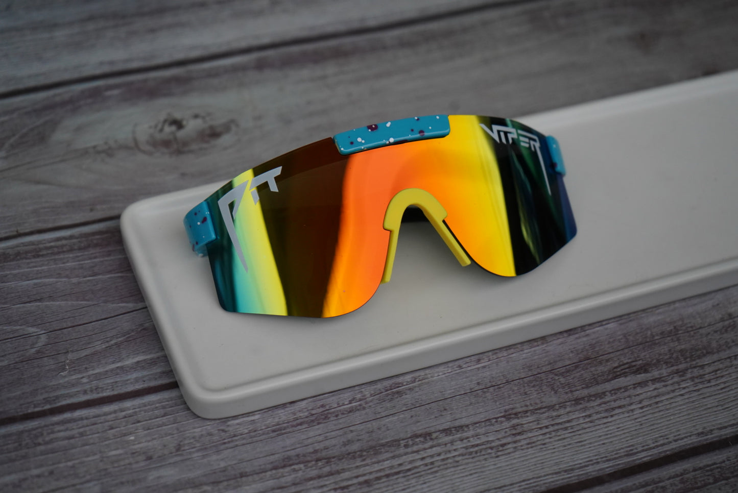 Youth sky blue mirrored pit vipers with red & white specks