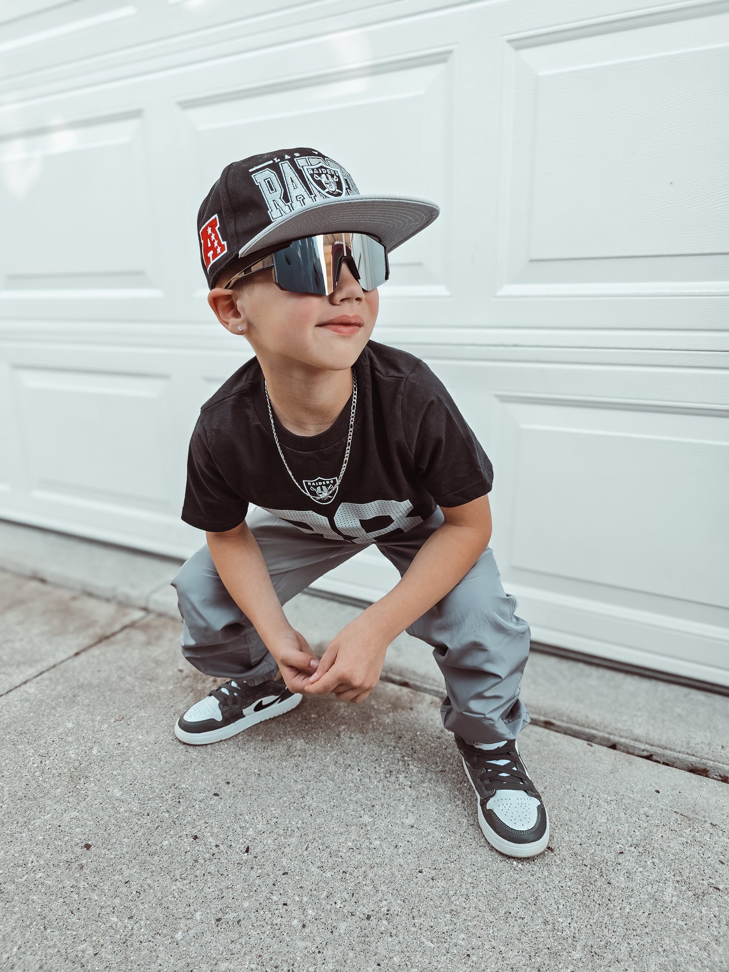 Black sports sunnies w/ silver lens